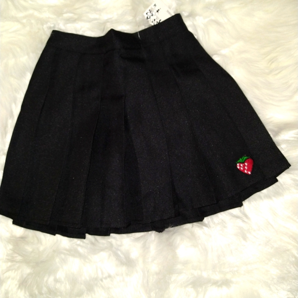 Tennis skirt with 🍓 at the bottom.
